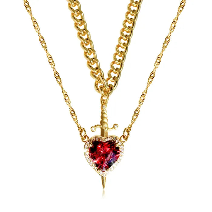 Gothic Heart Necklace with gold double-chain design and vivid red heart crystal accented by a dagger.