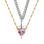 Gothic Heart Necklace featuring pink heart crystal and layered gold and silver chains with dagger.