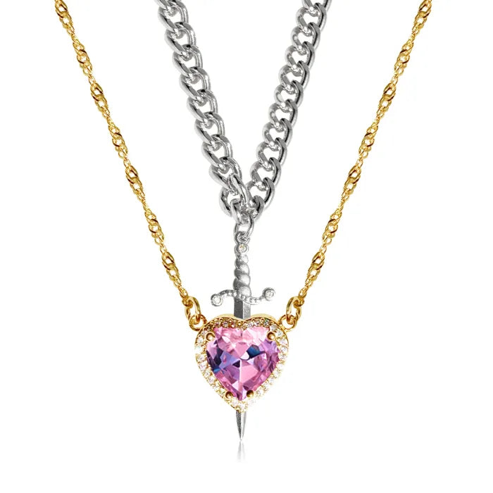 Gothic Heart Necklace featuring pink heart crystal and layered gold and silver chains with dagger.