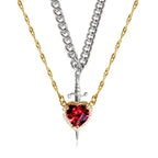 Gothic Heart Necklace mixing silver and gold chains with bright red heart gemstone.