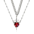 Gothic Heart Necklace in silver featuring layered chains and red heart gemstone with small dagger.