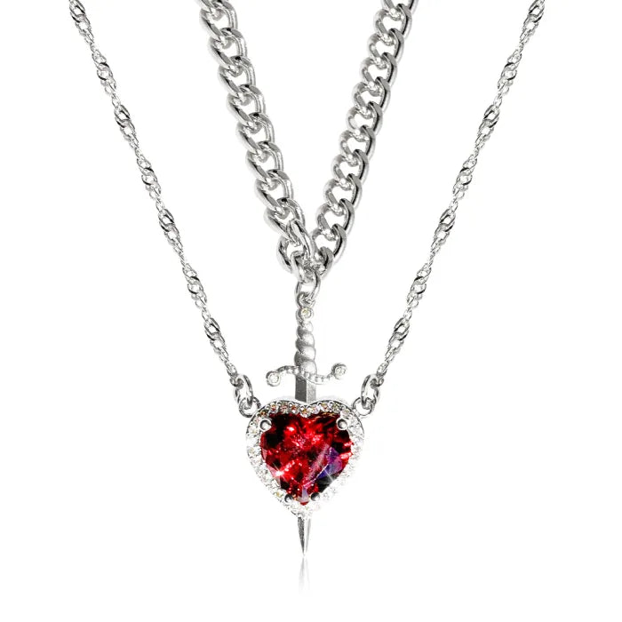 Gothic Heart Necklace in silver featuring layered chains and red heart gemstone with small dagger.