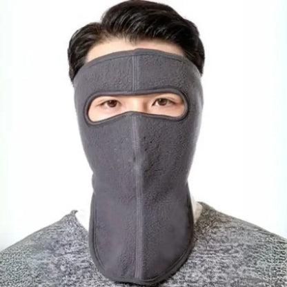 Gray full-face winter mask for cold weather protection and warmth during outdoor activities.