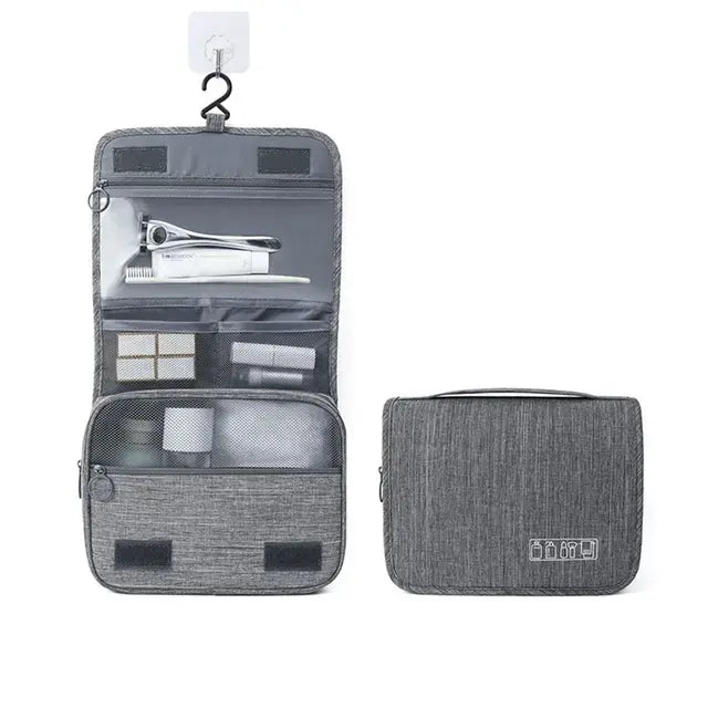 Gray hanging toiletry bag with multiple compartments, displayed open and closed on white background