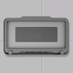 Sleek gray wall-mounted device with rectangular display screen and ventilation holes at the bottom.