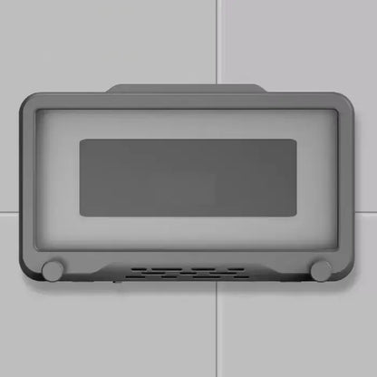 Sleek gray wall-mounted device with rectangular display screen and ventilation holes at the bottom.