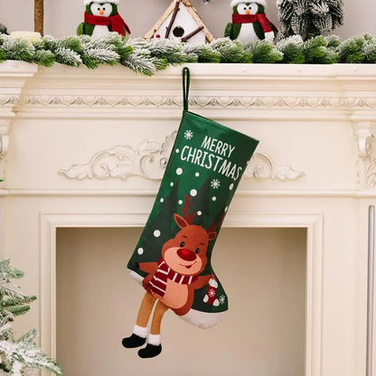 Green Christmas stocking with a reindeer in a scarf, adding a festive touch to holiday mantel displays.