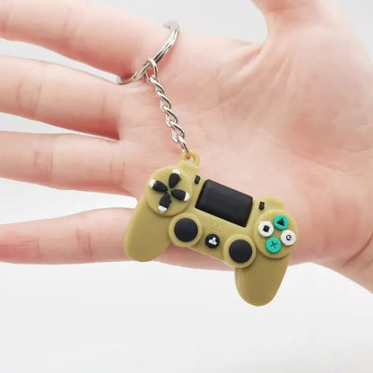 Green game controller keychain being held in hand, a creative gift for video game lovers.