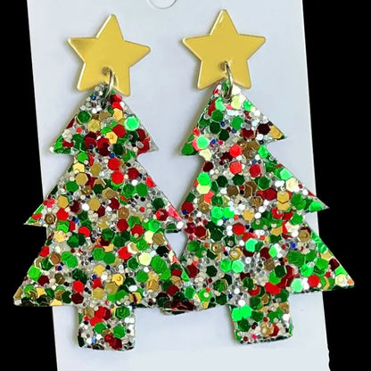 Handmade green glitter Christmas tree earrings with gold star tops, perfect for holiday celebrations.