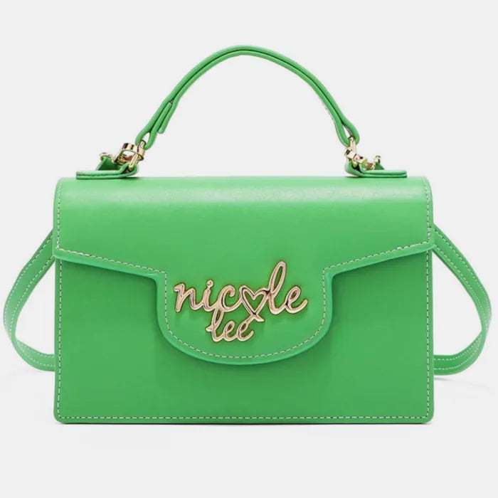 Vibrant green leather handbag with gold logo, top handle, flap closure, and structured rectangular shape