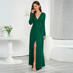 Green long sleeve V-neck maxi dress with a front slit and ruched waist detail.