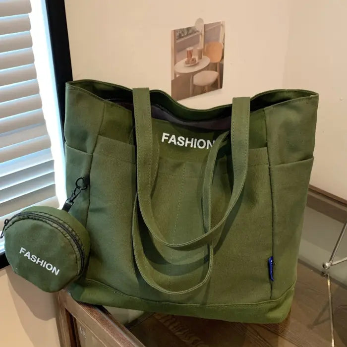 Green tote bag with a mini pouch displayed on a wooden table, ideal for everyday casual use