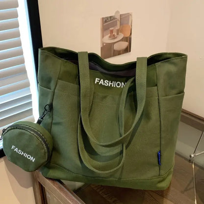 Green tote bag with a mini pouch displayed on a wooden table, ideal for everyday casual use