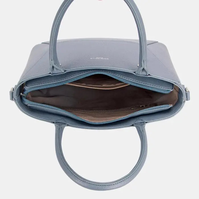 Open top view of grey leather tote showing spacious brown lined interior