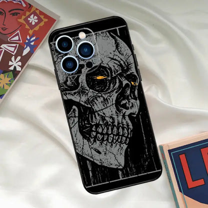 Grunge skull phone case with yellow glowing eyes and textured black background, edgy and artistic.