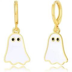 Close-up of gold hoop Halloween earrings with white enamel ghost charms and black eyes.