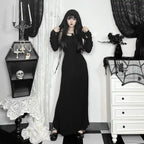 Halloween Elvira outfit gothic hooded black dress with long sleeves styled in spooky indoor setting
