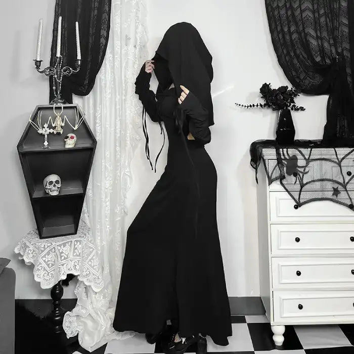 Halloween Elvira outfit side view of black hooded dress with ruched sleeves and witchy dark aesthetic