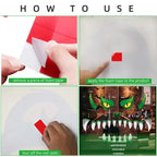 Halloween garage decor installation steps showing how to apply foam tape to attach dragon face decals
