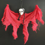 Halloween Ghost Skull figure with bright red shredded cloth and black braided hair.