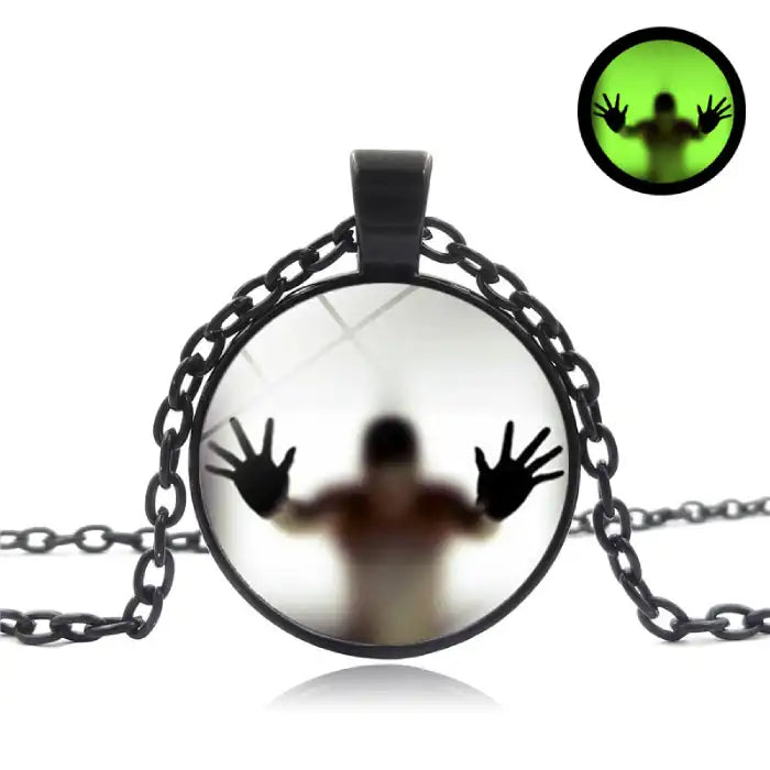 Halloween Glow necklace with spooky silhouette on black chain and glow-in-the-dark feature.