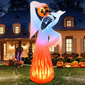 Halloween inflatable decoration of tall ghost with flaming base holding pumpkin in spooky yard scene