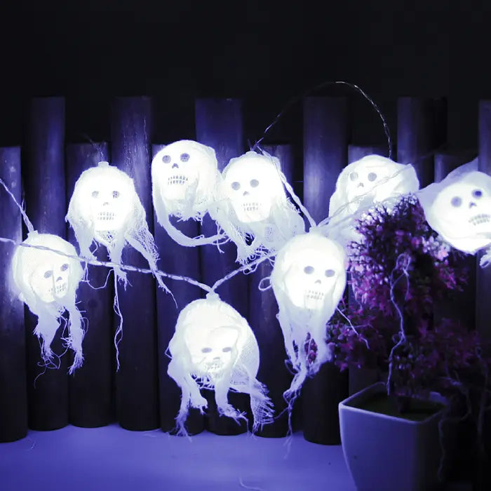 Halloween lights with pack of ghost skull heads and glowing blue sample lights.