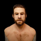 Halloween Mask resembling young bearded man with styled brown hair and lifelike silicone skin