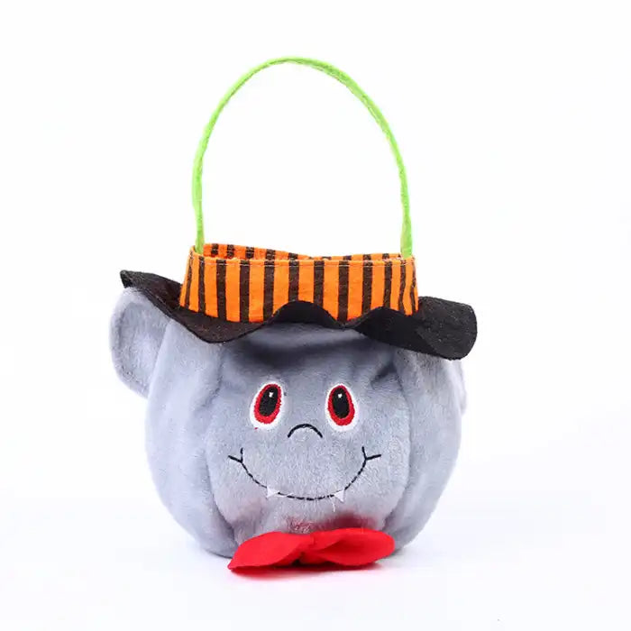 Halloween pumpkin candy bag shaped like soft grey ghost with green handle and red bow