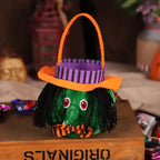 Halloween pumpkin candy bag designed as green witch with striped hat and orange handle
