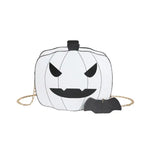 White Halloween Pumpkin Head bag with black eyes and mouth with gold chain and bat charm