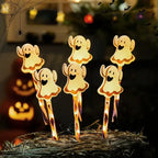 Halloween Pumpkin LED lights with cute ghost decorations glowing on hay in festive Halloween setting