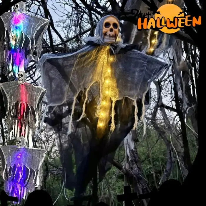 Halloween skeleton ghost decoration with color lights hanging on tree branches outdoors in spooky setup.