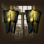 Two glowing halloween skeleton ghosts with hanging fabric in front of eerie backlit window for decor scene.