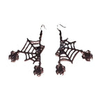 Halloween spider web earrings featuring glossy black finish and dangling red rhinestone spiders