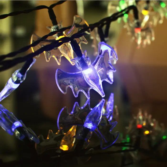 Halloween string lights featuring glowing LED bat-shaped bulbs with transparent wings