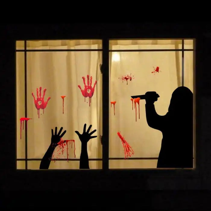 Halloween window decal showing bloody hands, knife silhouette, and shadowy murder scene behind curtain.