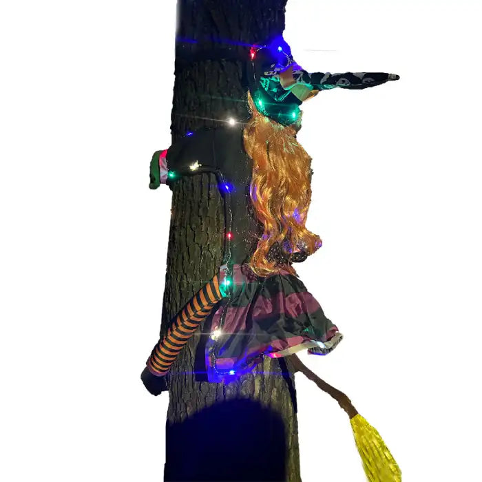 Halloween Witch Outdoor Courtyard Pendant with LED lights wrapped around tree after crash effect.