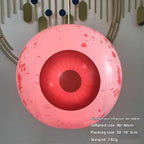 Halloween yard inflatables red glowing eyeball with blood splatter effect for haunted house decor.