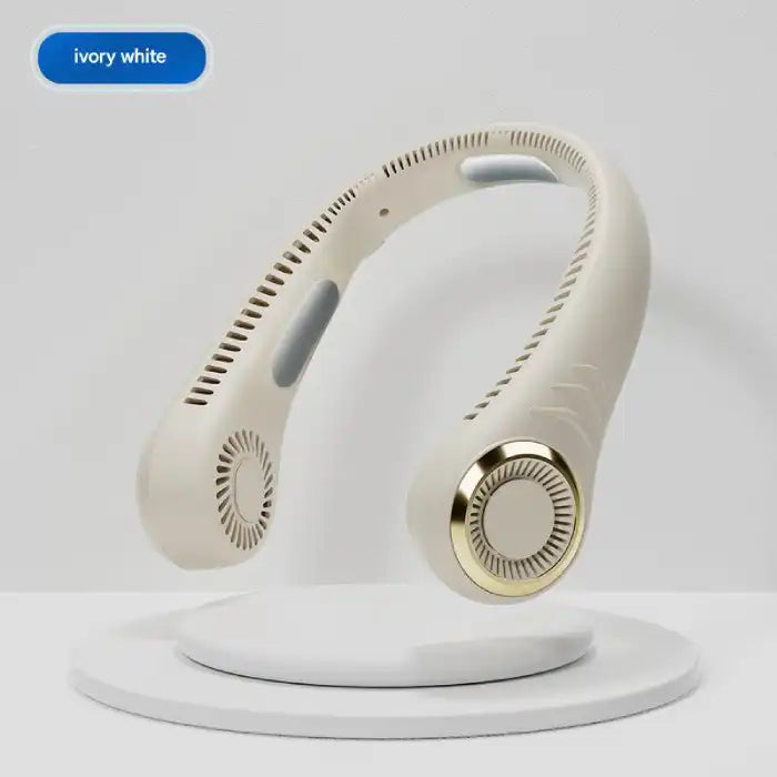 Ivory white halterneck fan with gold trim displayed on stand with minimal design focus.