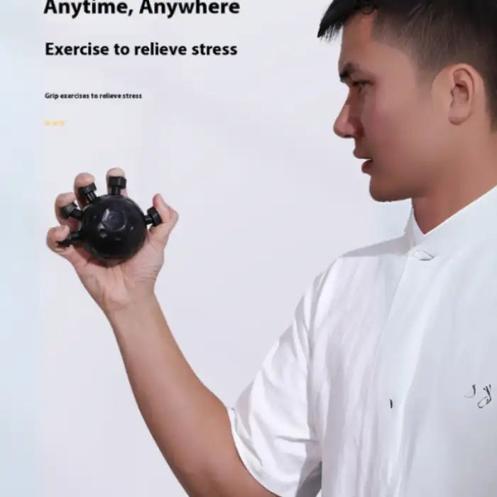  .Hand Strengthener shown being used by a man to relieve stress and build finger grip strength