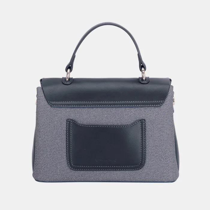 Back view of gray handbag showing black leather rear pocket and textured fabric body