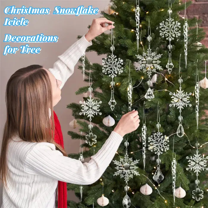  Person decorating Christmas tree with crystal snowflake ornaments and icicle drops, showing installation process