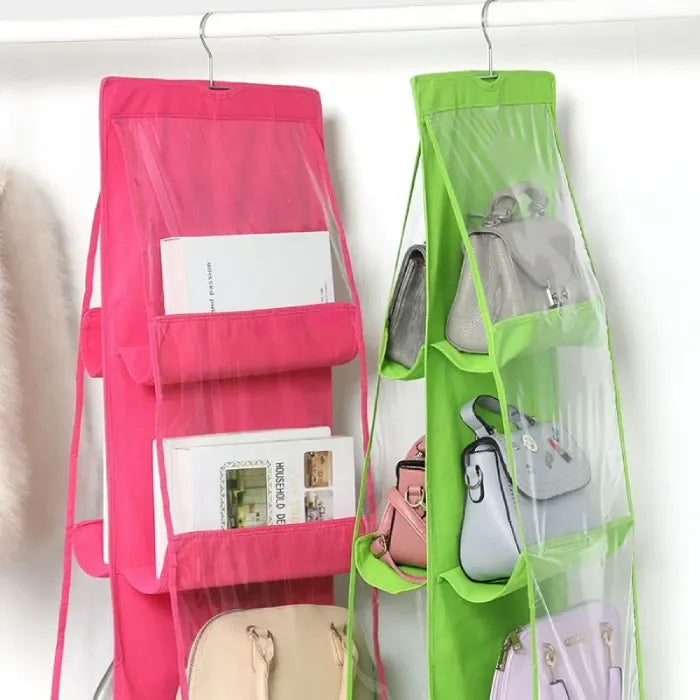 Hanging organizer with purses in transparent pockets.