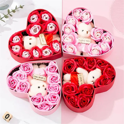 Heart-shaped gift box with teddy bear and red and pink artificial roses for romantic gifts.