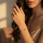 heart-charm-bracelet worn by woman in soft light, featuring dainty hearts and minimalist style for a romantic gift-ready look