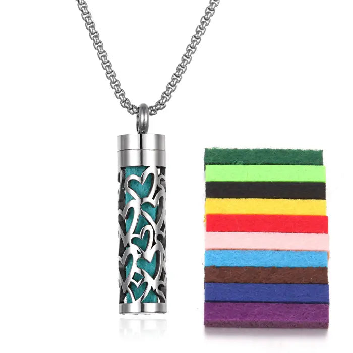 Heart pattern stainless steel diffuser pendant with colorful felt pads for essential oil aromatherapy.