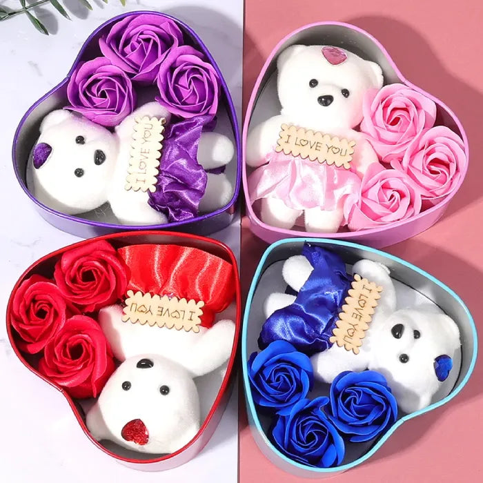 Collection of heart-shaped gift boxes featuring teddy bears and roses in red, pink, purple, and blue colors