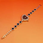 Heart stone watch with black dial and jeweled crystal border paired with black gemstone bracelet links for a luxurious fashion accessory style