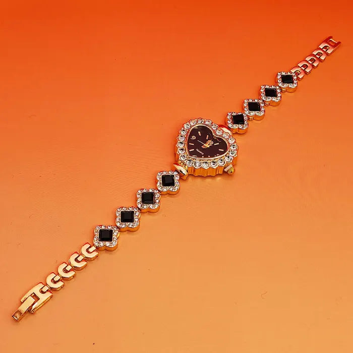 Heart stone watch with black dial and jeweled crystal border paired with black gemstone bracelet links for a luxurious fashion accessory style